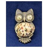 Qwl brooch or pin with marbled eyes and belly