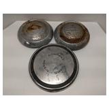 Group of vintage hub caps
