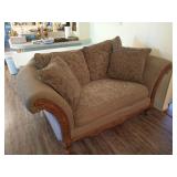 Green fabric loveseat w/ wood accents