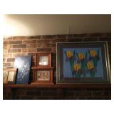 Group of art work on mantle