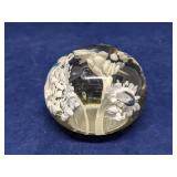 Glass paperweight with white flowers