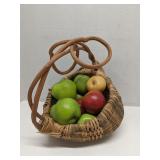 Woven harvest basket with ceramic fruit