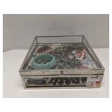 Large group of costume jewelry in clear case