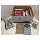 Group of books, mostly cookbooks