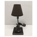 Mouse reading a book desk lamp