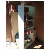 Shelf with planters and hardware in shop corner