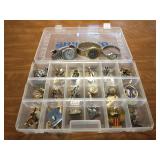 Plastic container of cuff links, pins & watches