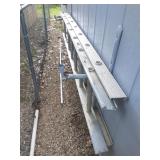 Extension ladder on side of shed