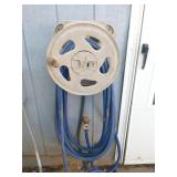 Garden hose on plastic reel