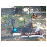 Group of planters and yard art