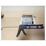 Caulk and caulk gun