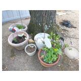 Group of planters and yard art
