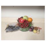 Group of plastic fruit and metal center piece
