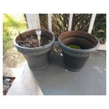 Two plastic planters on front porch