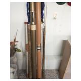 Group of vintage fishing poles and cases