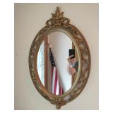 Oval mirror on foyer wall