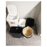 Group of trashcans and mop buckets
