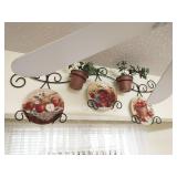 Group of decorations above window and cabinets