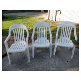 3 Stackable plastic chairs, one has broken arm