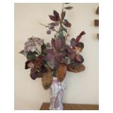 Ceramic vase with faux flowers arrangment