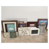 Group of picture frames and signs