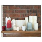 Group of candles and holders on mantle