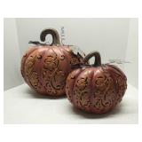 Decorative metal cutout pumpkins, lighted