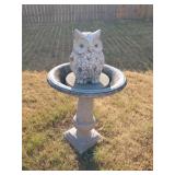 Concrete bird bath and plastic owl