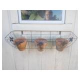 Metal planter with 3 pots on shed
