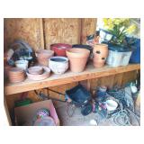 Gardening supplies on left side of shed