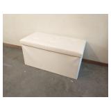 White padded vinyl storage chest