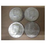 Four 1964 Kennedy Half Dollars