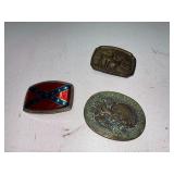 three mens belt buckles