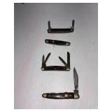 set of four pocket knivies