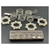 Lovely napkin ring holders, and wine charms, see picture for details.