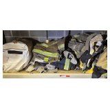 Shelf lot marked 5073 of assorted firefighter turn out gear, and safety gear bag. See pictures for details.