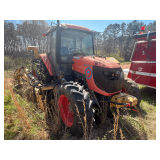 Kubota M108S tractor with rotary arm mower.