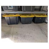 THREE 27 GALLON TUBS ON FLOOR BENEATH SHELF UNIT FILLED WITH RV HOSES AND ACCESSORIES