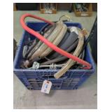 MILK CRATE FILLED WITH PLASTIC TUBING, RUBBER TUBING, BATTERY CABLES, STEEL CABLE, AND MORE