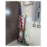 ALL ITEMS LEANING IN CORNER MARKED 1025 INCLUDING FLAGPOLE WITH US FLAG, BROOMS, SHOP BROOMS, AND HOMEMADE MILITARY RIFLE REPLICA