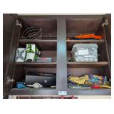 CONTENTS OF UPPER CABINET MARKED 1001 INCLUDING GOLF BALLS, CHANNEL LOCK PLIERS, AND MORE