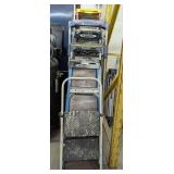 ALL LADDERS IN STACK MARKED 1183 FROM SMALL TO LARGE METAL PLATFORM LADDER, SEVEN LIGHTERS TOTAL