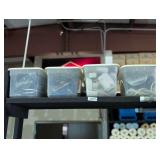 THREE SMALL TUBS FILLED WITH EXTENSION CORDS, POWER STRIPS, VIDEO / AUDIO CABLES, AND MORE