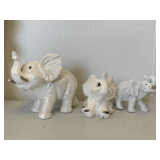 THE MARQUISE COLLECTION WHITE IRIDESCENT ELEPHANT WITH GOLD PAINTED TUSKS (ONE TUSK BROKEN) 7 1/2' LONG X 7 1/2' TALL & 2 WHITE ELEPHANTS (5 1/2' LONG X 5' TALL, 6 1/2' LONG X 4 1/4' TALL)