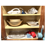 KIT… Cabinet lot marked 1118 of content of upper cabinets on both sides of microwave, includes a ToastMaster electric carving knife, Farberware electric hand mixer, serving bowl, Fiestaware creamer 