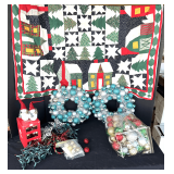 Garage… Assorted Christmas decor to include decorated silver wreaths, Christmas ornaments, custom made table covering, and more. See pictures for details.