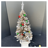 Garage… Mini flocked Christmas tree, see pictures or details.