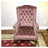 Master… Brown wing back chair with tufted back,  nail head trim, and rolled arms, see pictures for details.