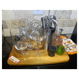 KIT… Drink station with cutting board, shaker cup, and assorted glassware. See pictures for details.