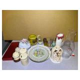 Assortment of home decor to include collectible salt and pepper shakers, porcelain trinket box, collector/souvenir plates, figurines, and more. See pictures for details.